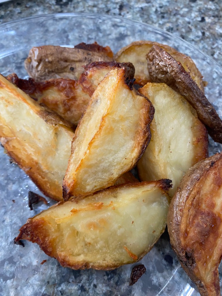 Crispy brown sliced fried potatoes made in the oven