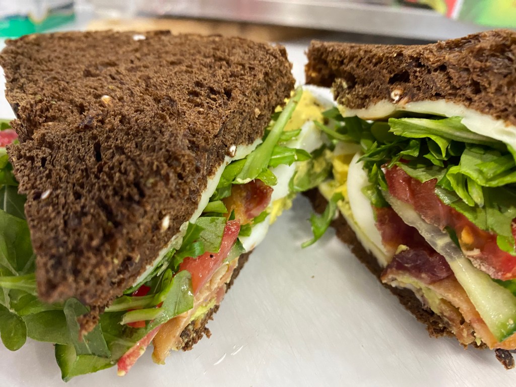 Avocado toast sandwich cut in half